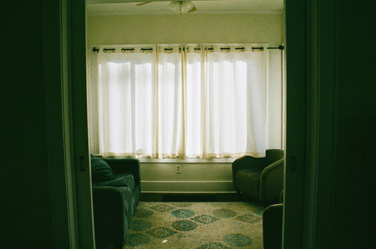 Small living room without a coffee table, showing an open layout with sofas facing each other and clear walking space
