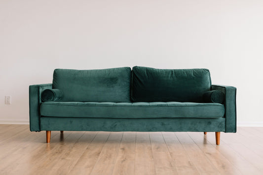 modern compact sofa placed against a clean wall representing the ideal sofa size for small living rooms